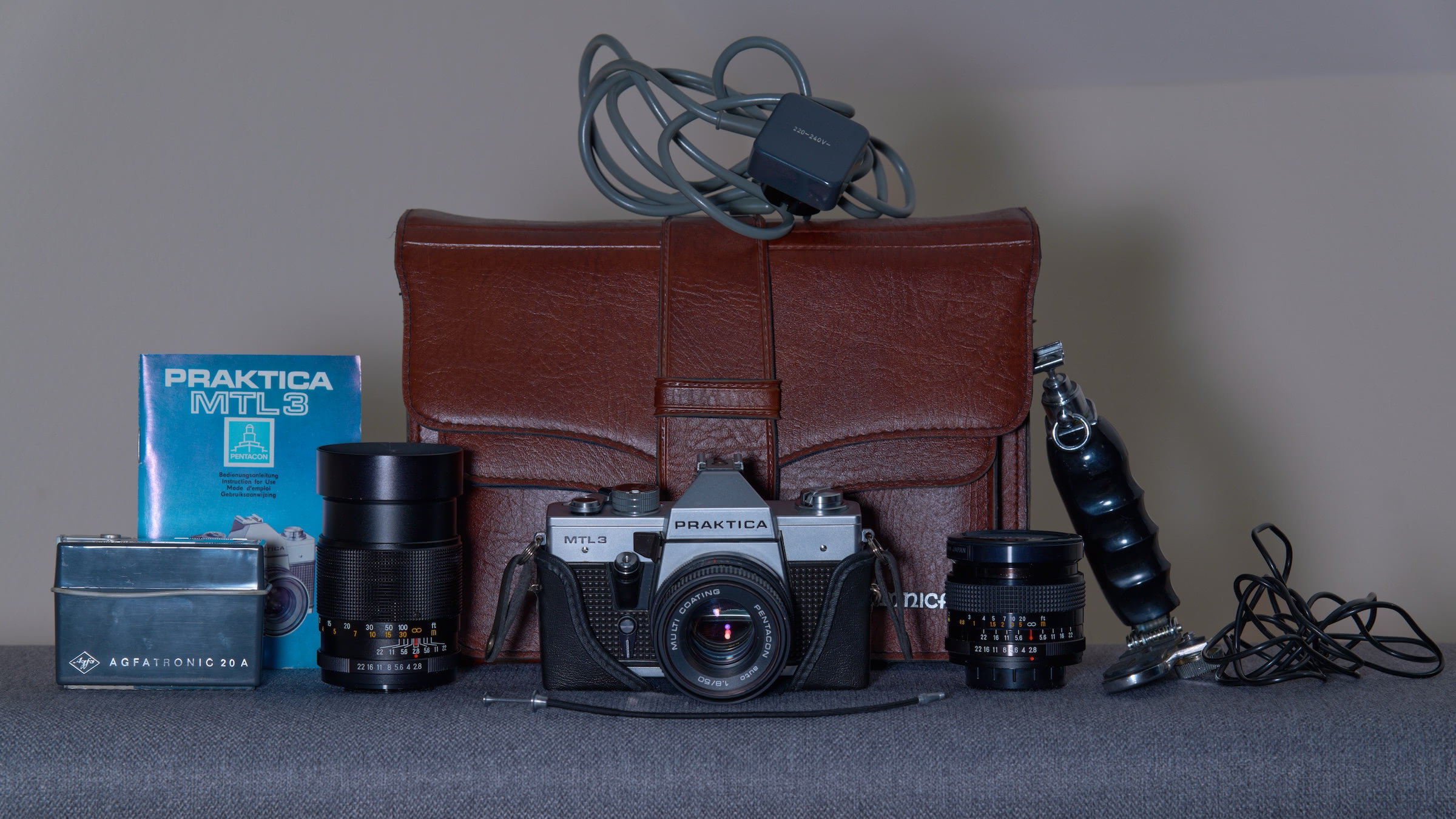 Praktica set: camera bag, body, lenses, and accessories